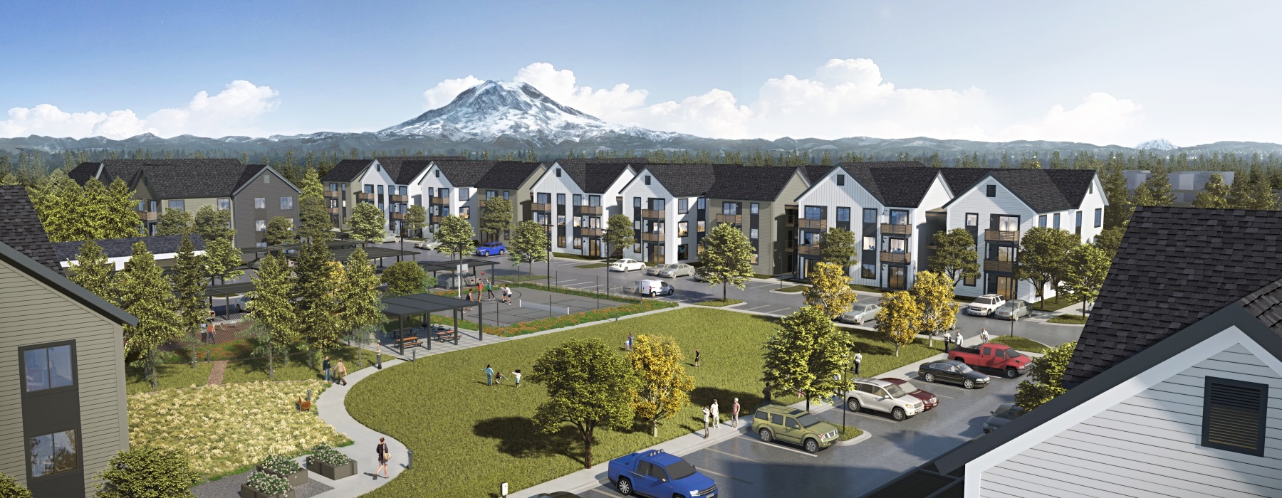 a group of apartments with a mountain in the background