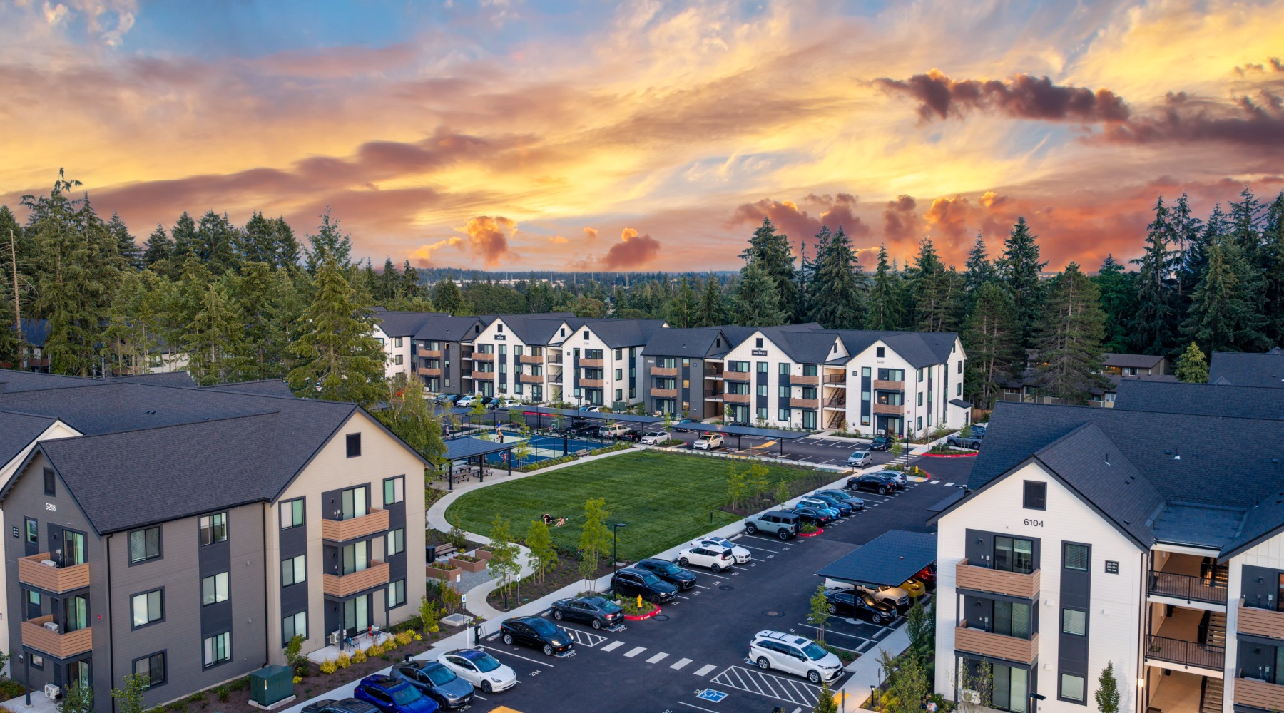 an apartment complex aerial at dusk