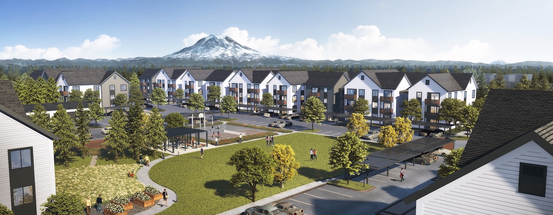 a group of houses with a mountain in the background