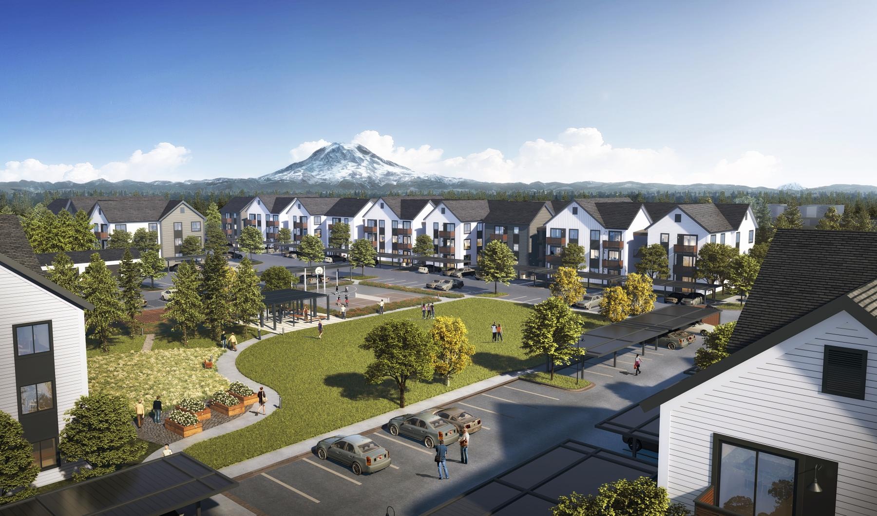 a group of houses with a mountain in the background